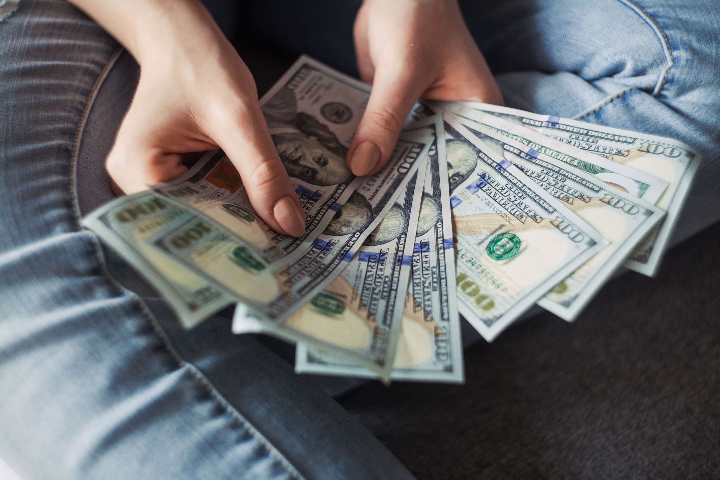Money Fanned Out in Persons Hands